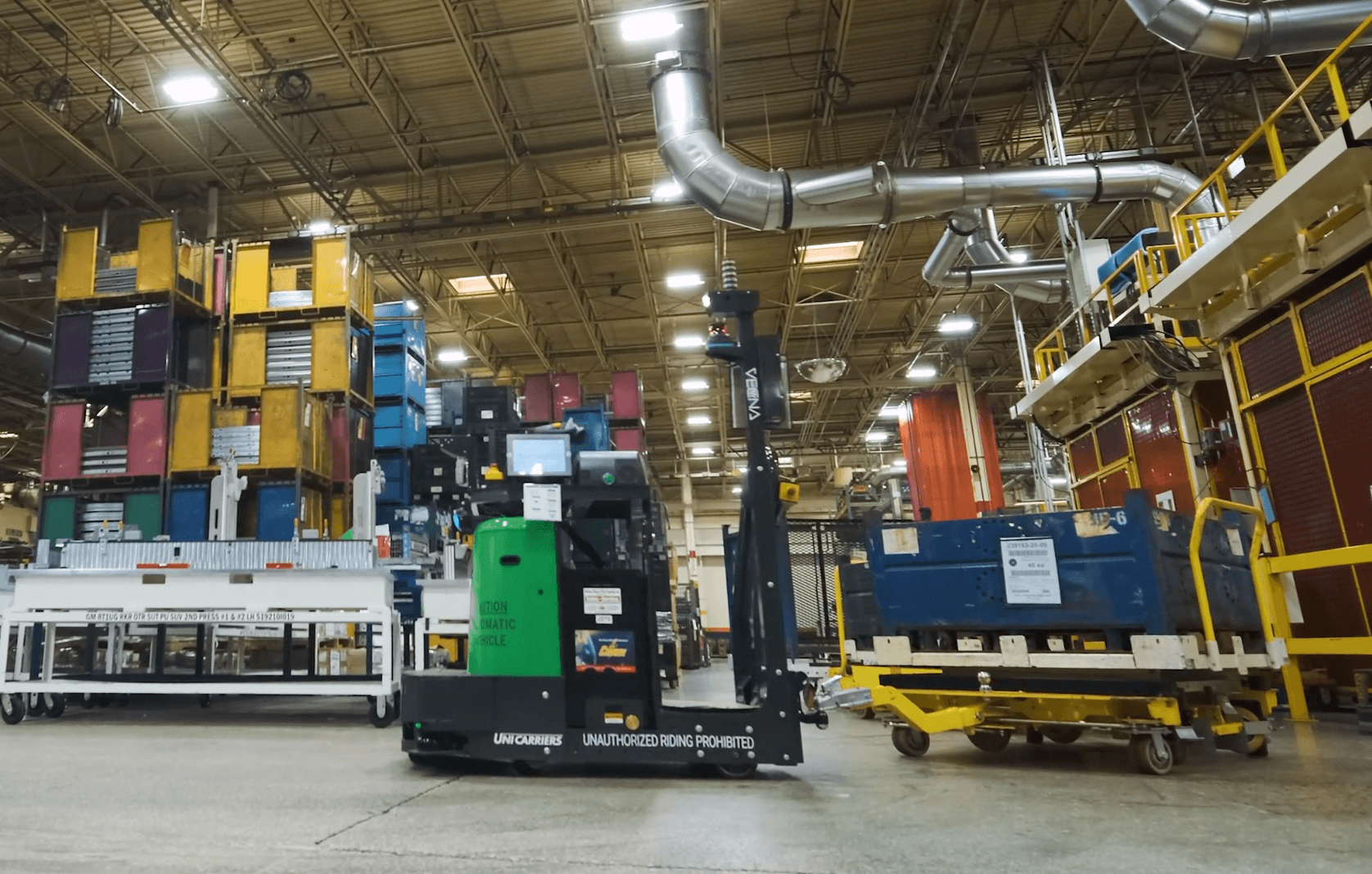 Autonomous forklift maneuvering near loaded pallets inside a facility